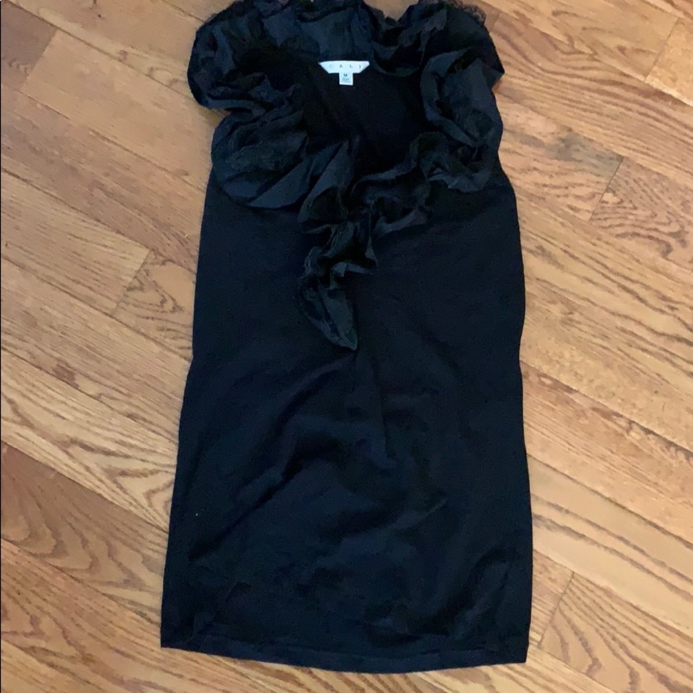 Cabi sleeveless with black ruffles around v neck